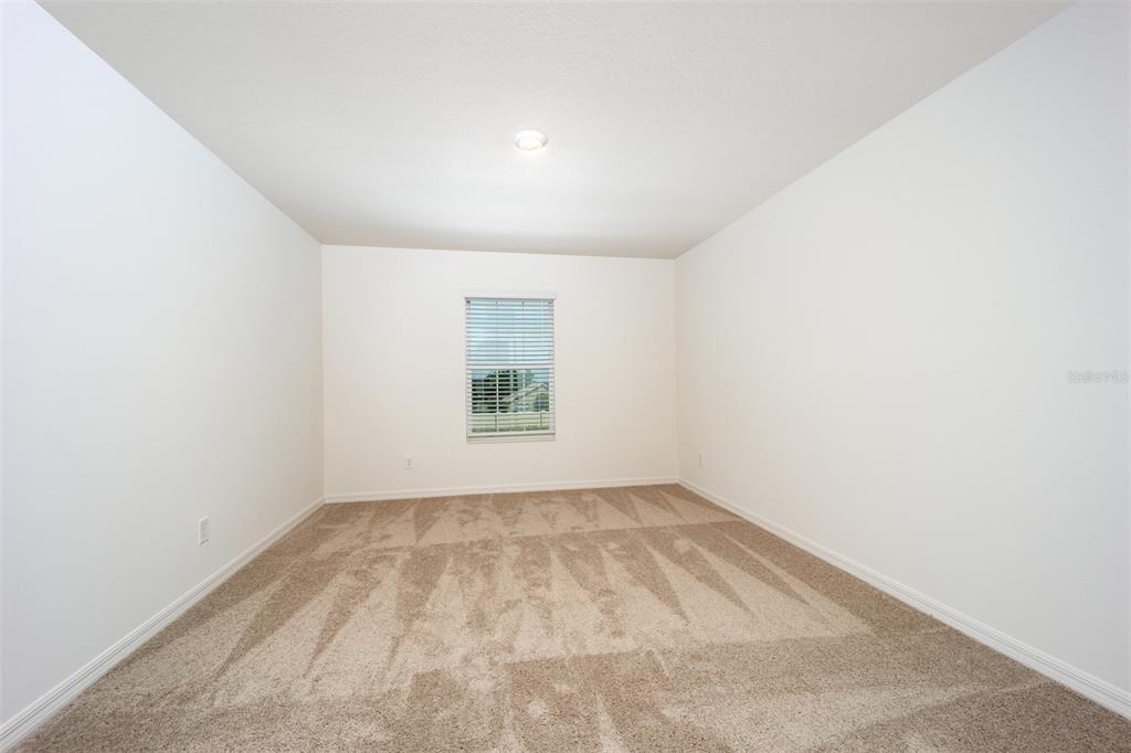 745 Poppy Lane Dundee, FL 33838 - Photo 14 of 16 an empty room with a window