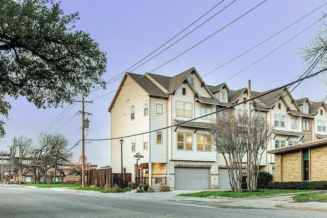 a view of a white building among the street