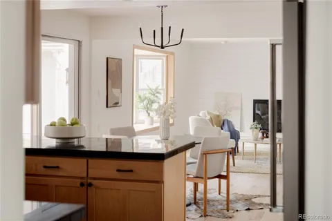 a kitchen with stainless steel appliances granite countertop a sink and a window