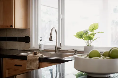 a kitchen with a sink and a window