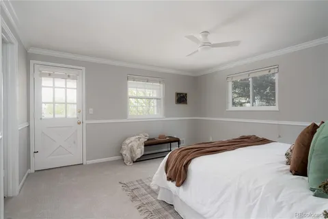 a bedroom with bed and a window