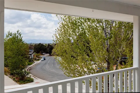 a view of a yard from a balcony