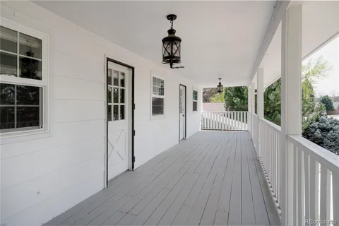 a view of a balcony with wooden floor