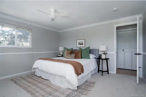a bed room with a bed and a chandelier
