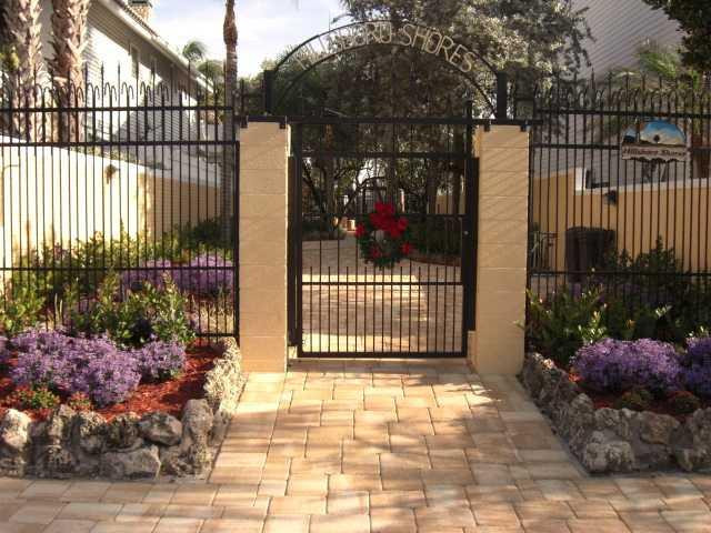 3200 Dover Road Pompano Beach, FL 33062 - Photo 23 of 25 a view of a house with a small yard and wooden fence