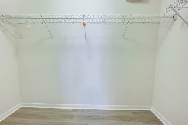 a bedroom with bed and a window