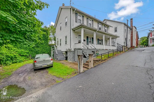 a kitchen with stainless steel appliances granite countertop a refrigerator sink and cabinets