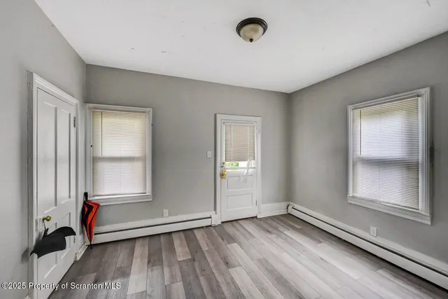 a view of a livingroom with furniture and a window