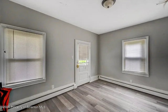a bathroom with a shower and a toilet