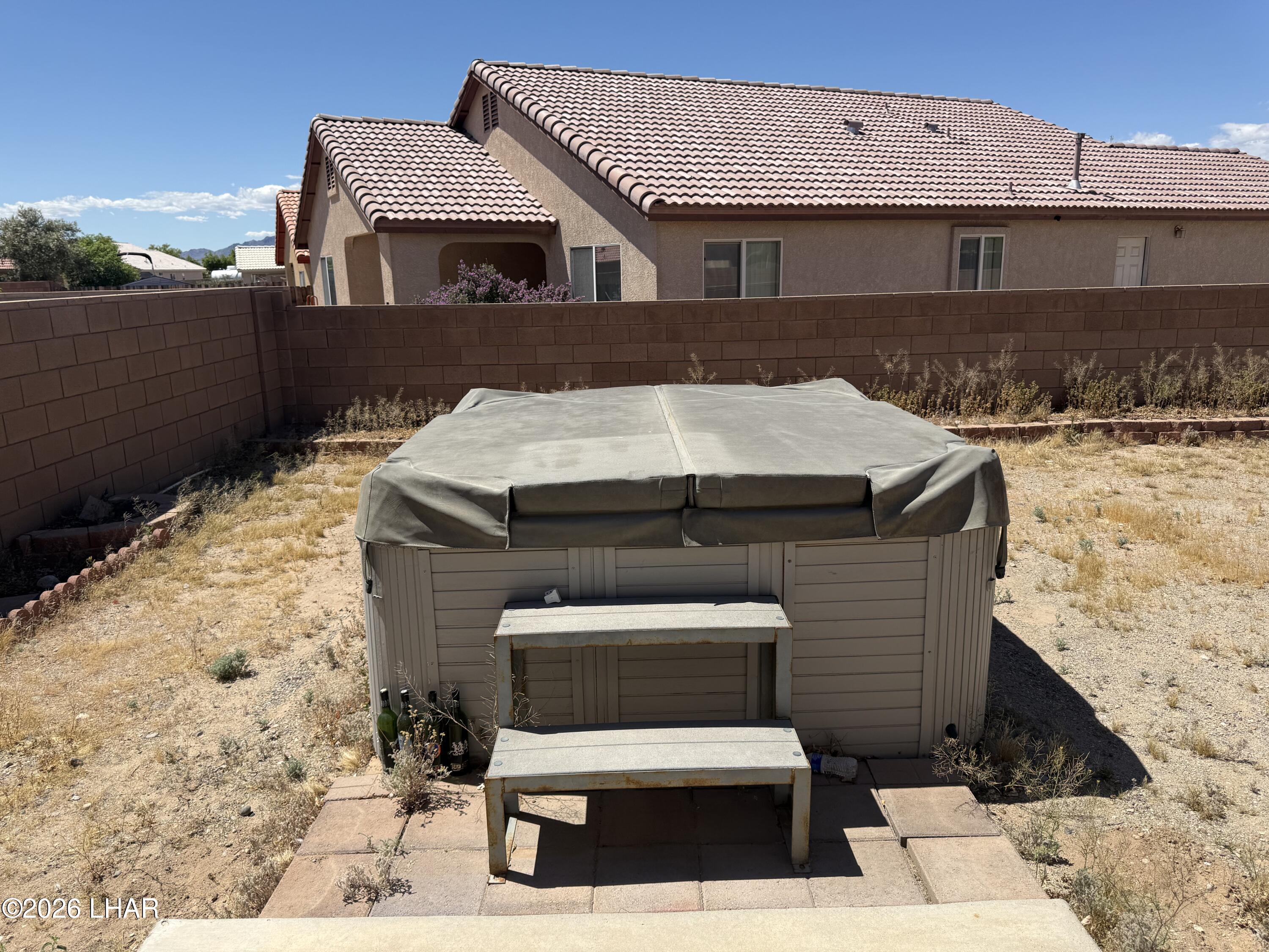 4897 South Rinaldi Drive Fort Mohave, AZ 86426 - Photo 16 of 22 a front view of a house with a yard