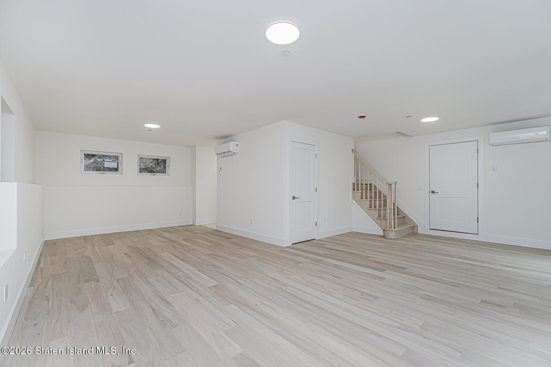 54 Cedarcliff Road Staten Island, NY 10301 - Photo 39 of 49 a view of an empty room with wooden floor