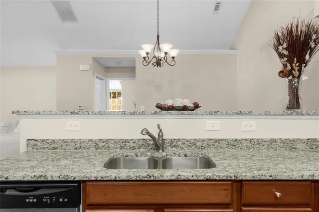 a bathroom with sink granite and a vanity