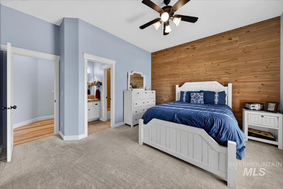 414 East Shafer View Drive Meridian, ID 83642 - Photo 27 of 50 Bedroom #3 is Spacious 14x12 has an Accent wall featuring knotty pine shiplap wall treatment, Plush carpeting, sunny window, walk-in closet, adjoining Jack & Jill bathroom