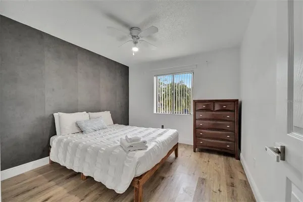 a bedroom with a bed and a dresser