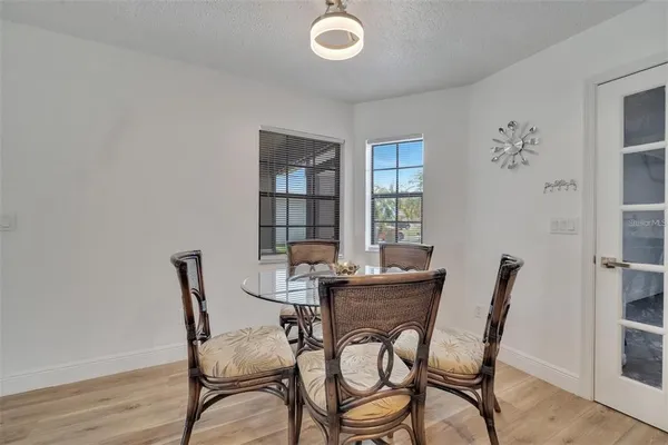 a view of a dining room with furniture and window