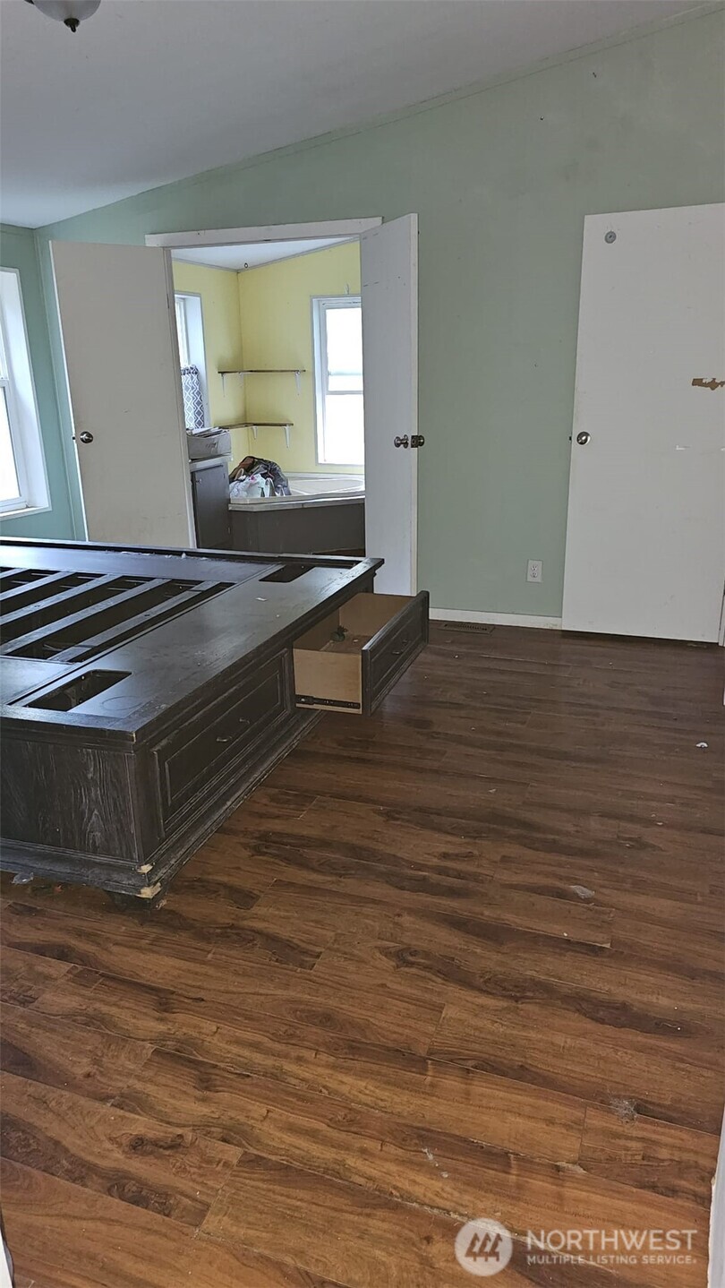 1104 East Alderwood Road Belfair, WA 98528 - Photo 5 of 15 a living room with wooden floor