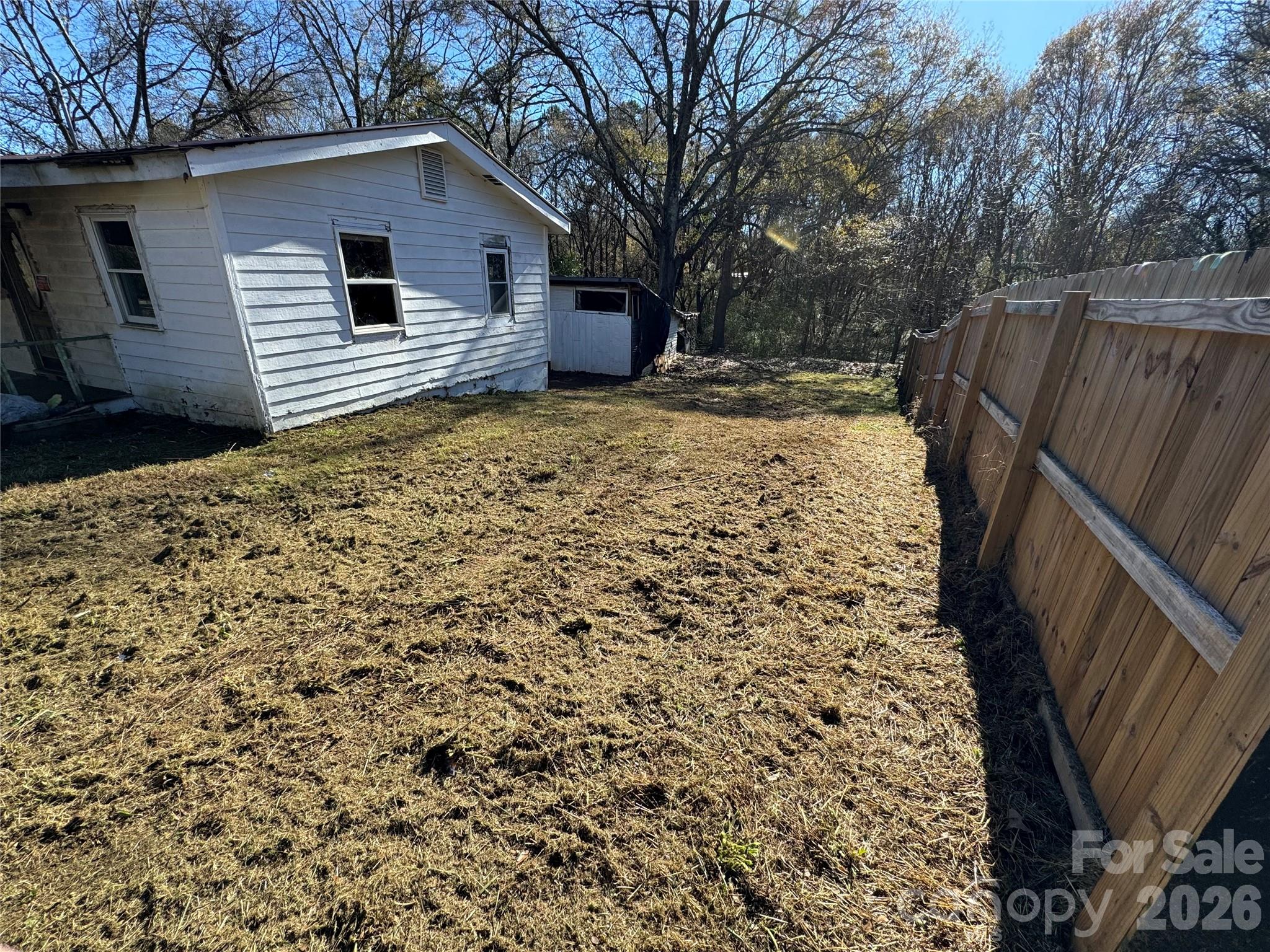 178 Newline Road Mooresboro, NC 28114 - Photo 2 of 9 a backyard of a house with wooden fence