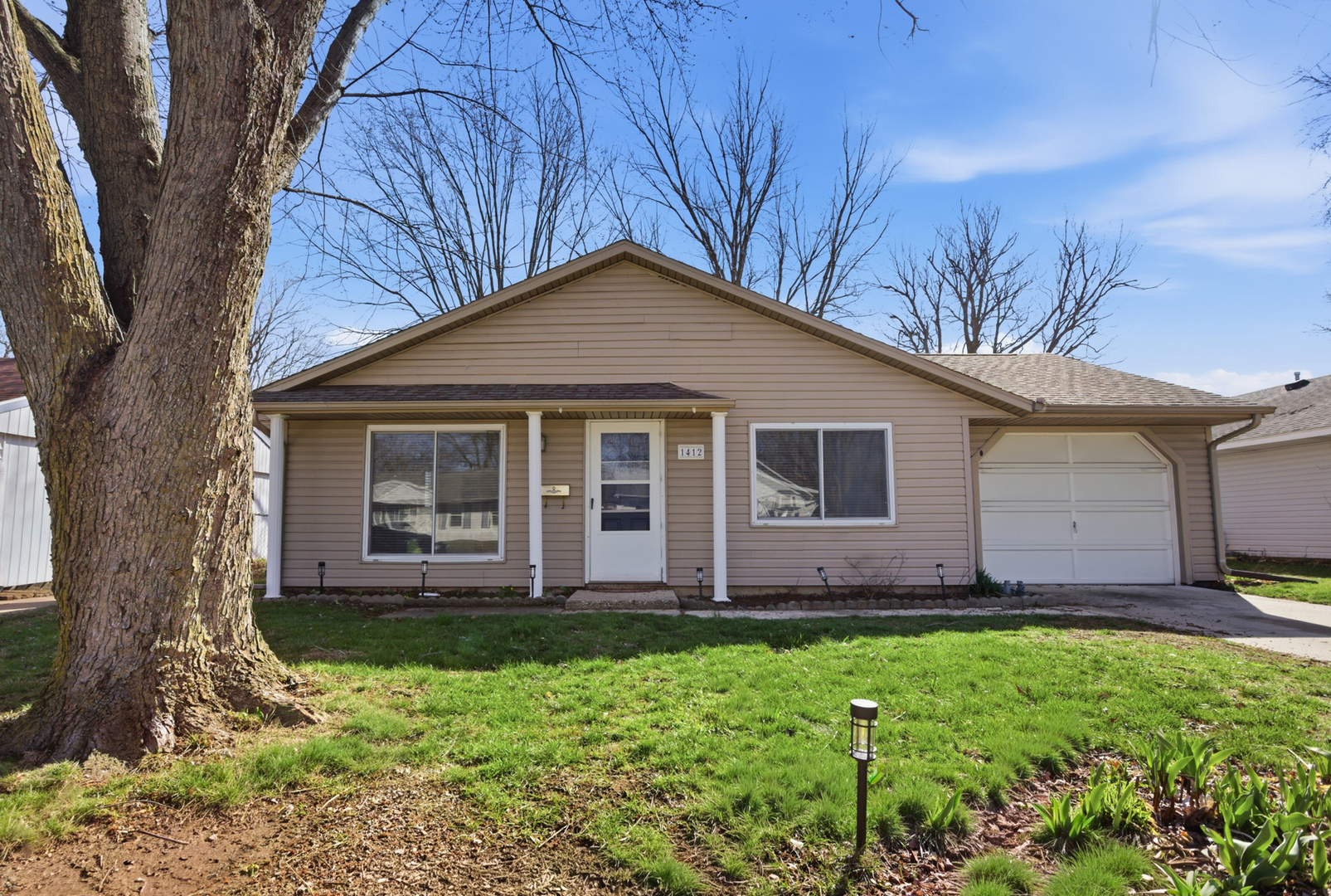 front view of a house with a yard
