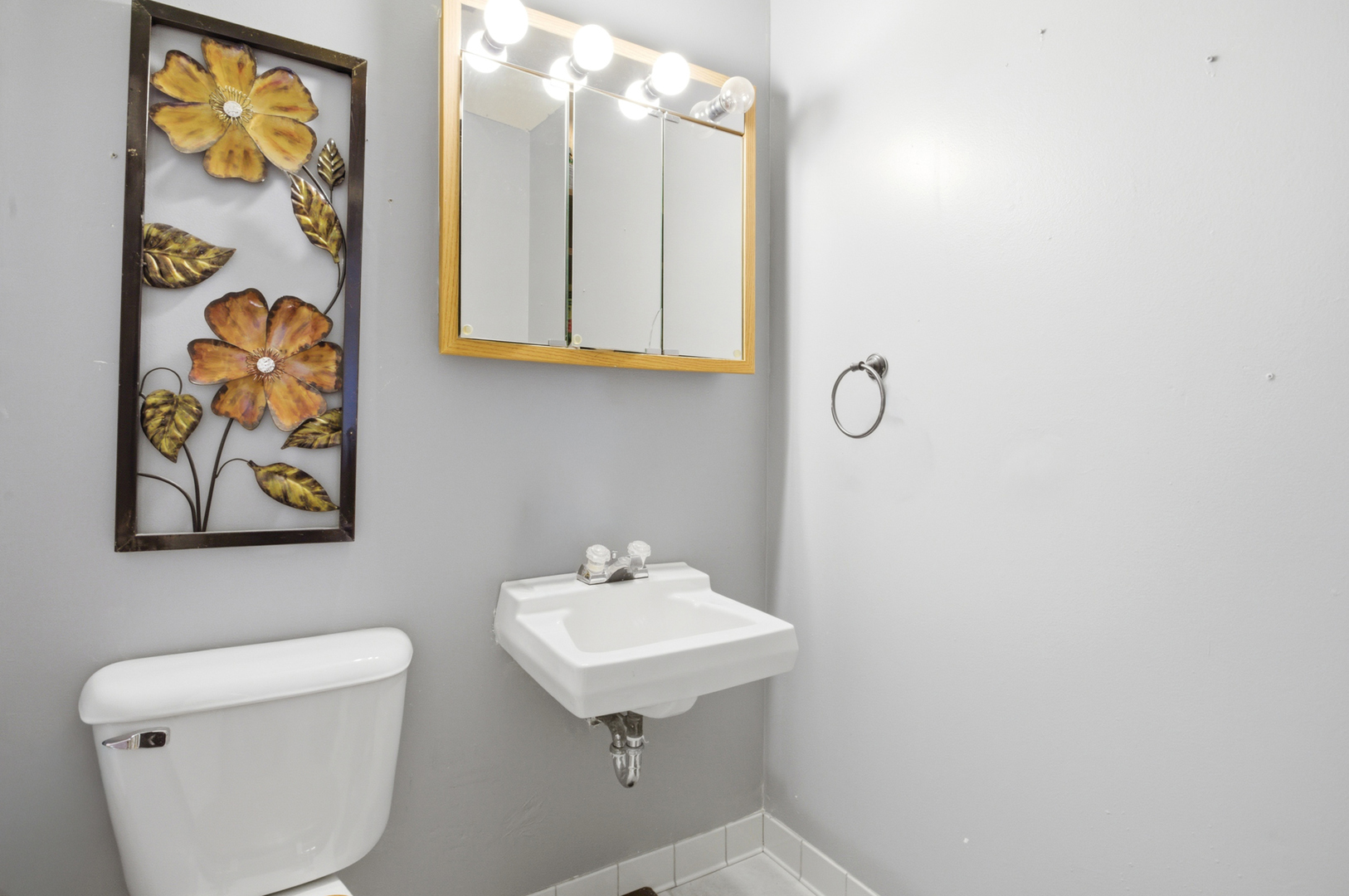 1412 South 2nd Street Mattoon, IL 61938 - Photo 11 of 20 a bathroom with a sink mirror and vanity