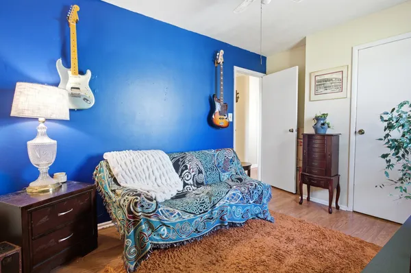 a living room with furniture and wooden floor