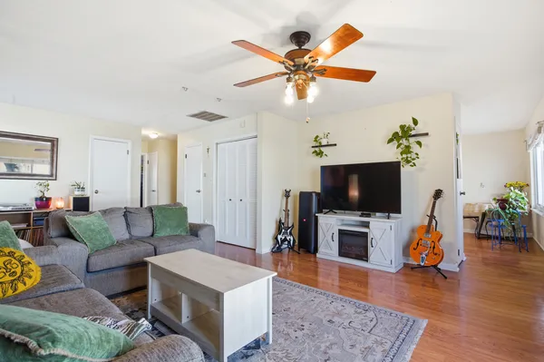 a living room with furniture and a flat screen tv