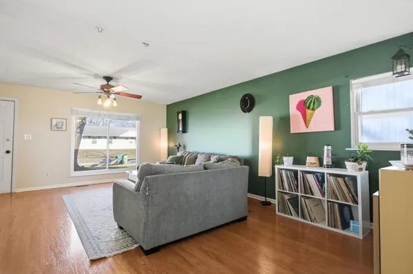 a living room with furniture and a large window