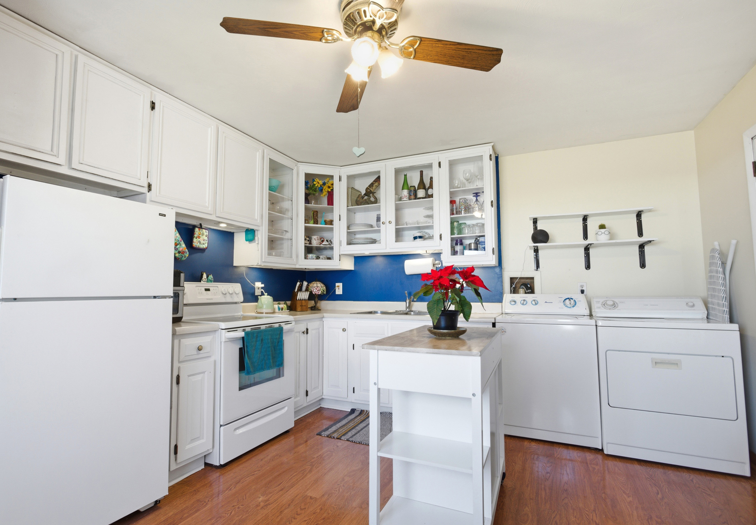1412 South 2nd Street Mattoon, IL 61938 - Photo 7 of 20 a kitchen with a white cabinets and white appliances