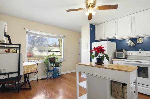 a kitchen with a table and chairs in it