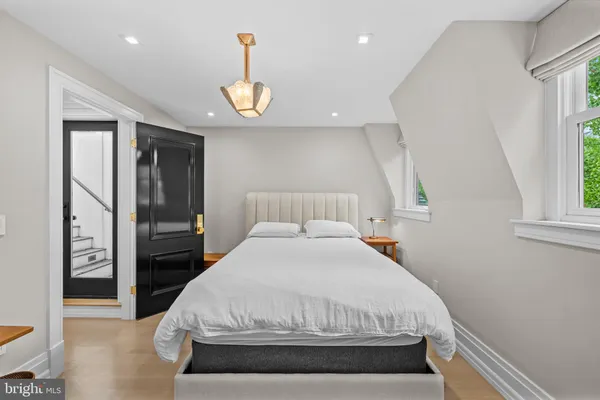 a large white bed in a white room