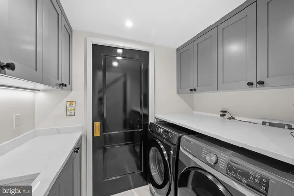 a utility room with cabinets