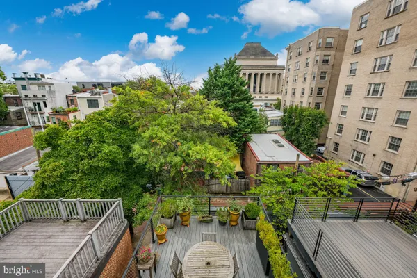 a view of a balcony with chairs