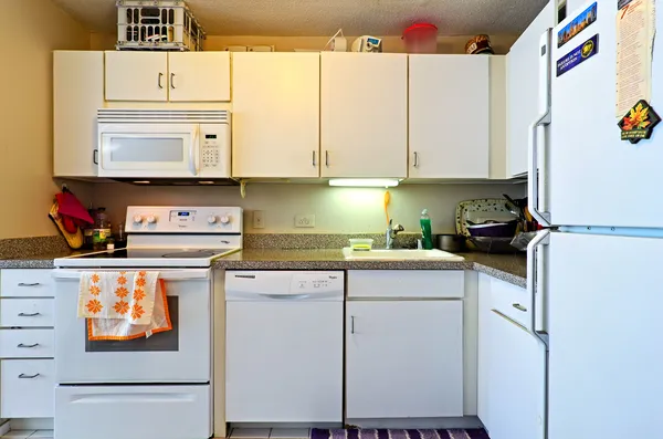 a kitchen with stainless steel appliances a stove a refrigerator and a sink