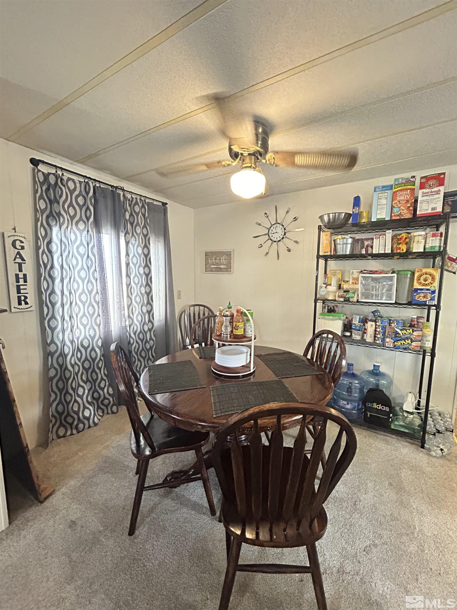 212 Coons Circle, Unit E Dayton, NV 89403 - Photo 4 of 20 a view of a dining room with furniture