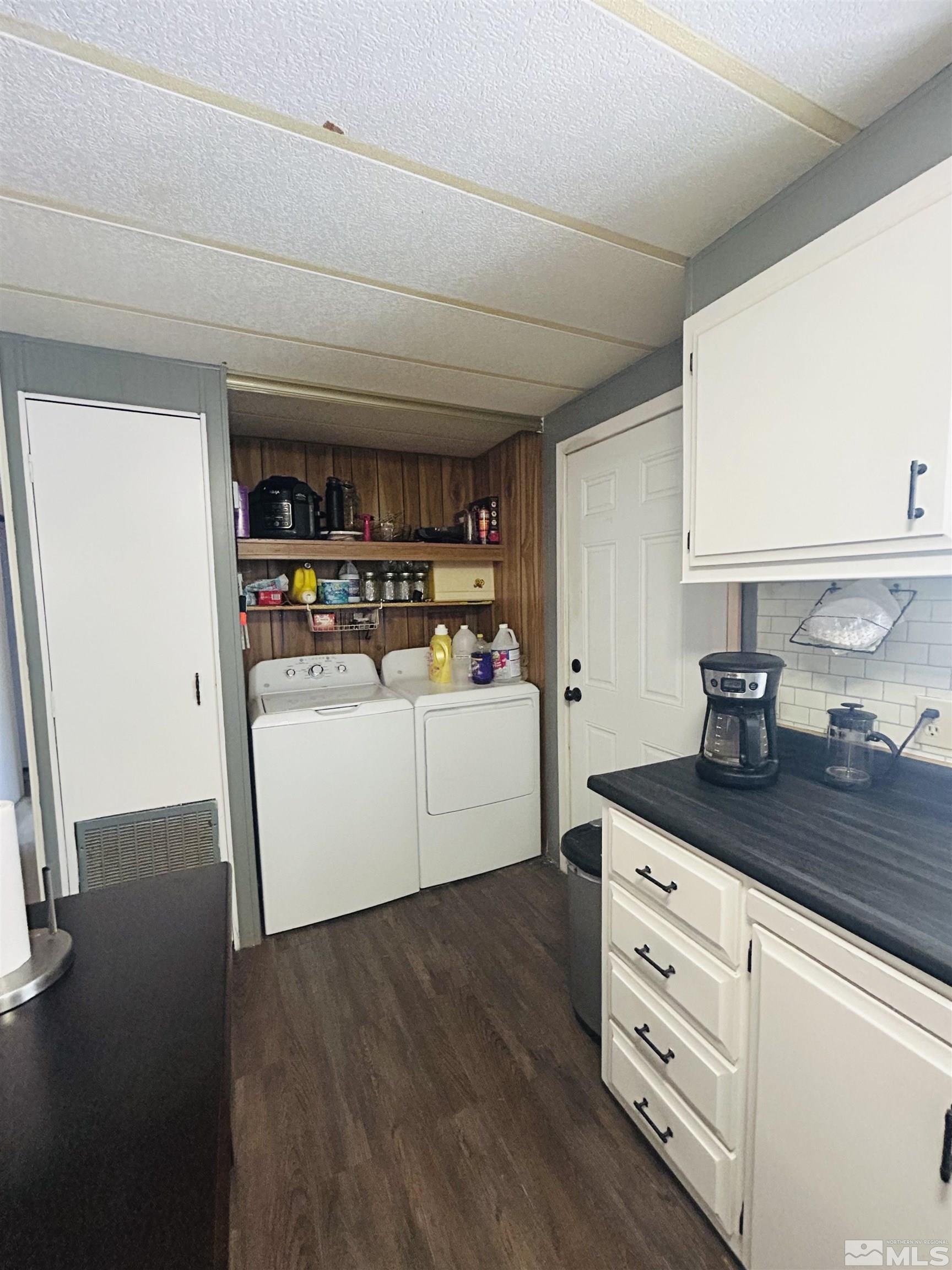 212 Coons Circle, Unit E Dayton, NV 89403 - Photo 7 of 20 a utility room with cabinets and washer dryer