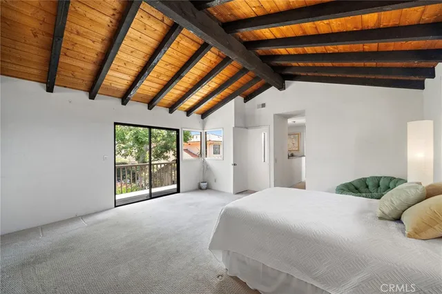 an aerial view of residential houses with outdoor space and street view