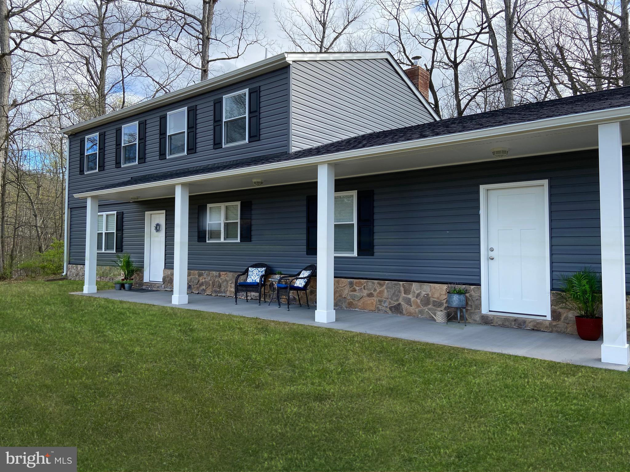 3797 Howellsville Road Front Royal, VA 22630 - Photo 2 of 66 a front view of a house with garden