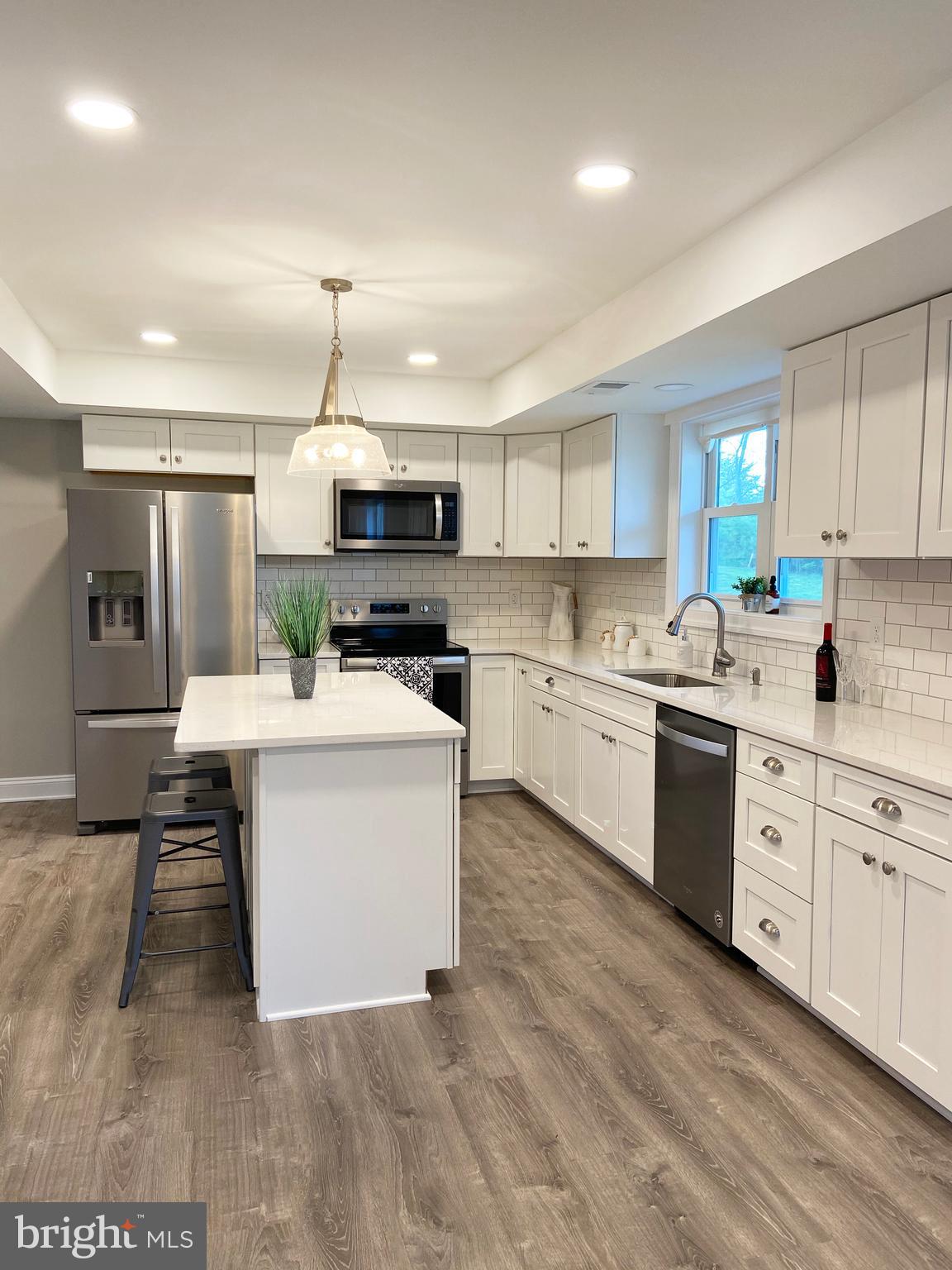 3797 Howellsville Road Front Royal, VA 22630 - Photo 11 of 66 a large kitchen with kitchen island a sink stainless steel appliances and cabinets
