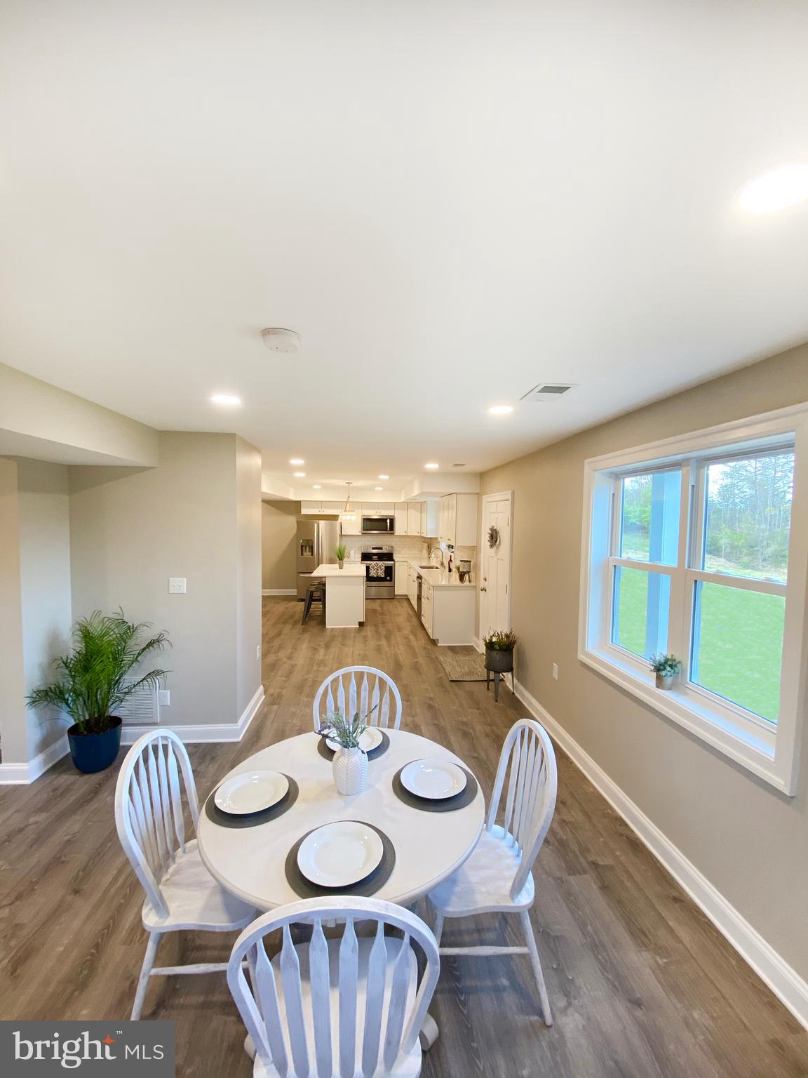 3797 Howellsville Road Front Royal, VA 22630 - Photo 66 of 66 a view of a dining room with furniture window and wooden floor