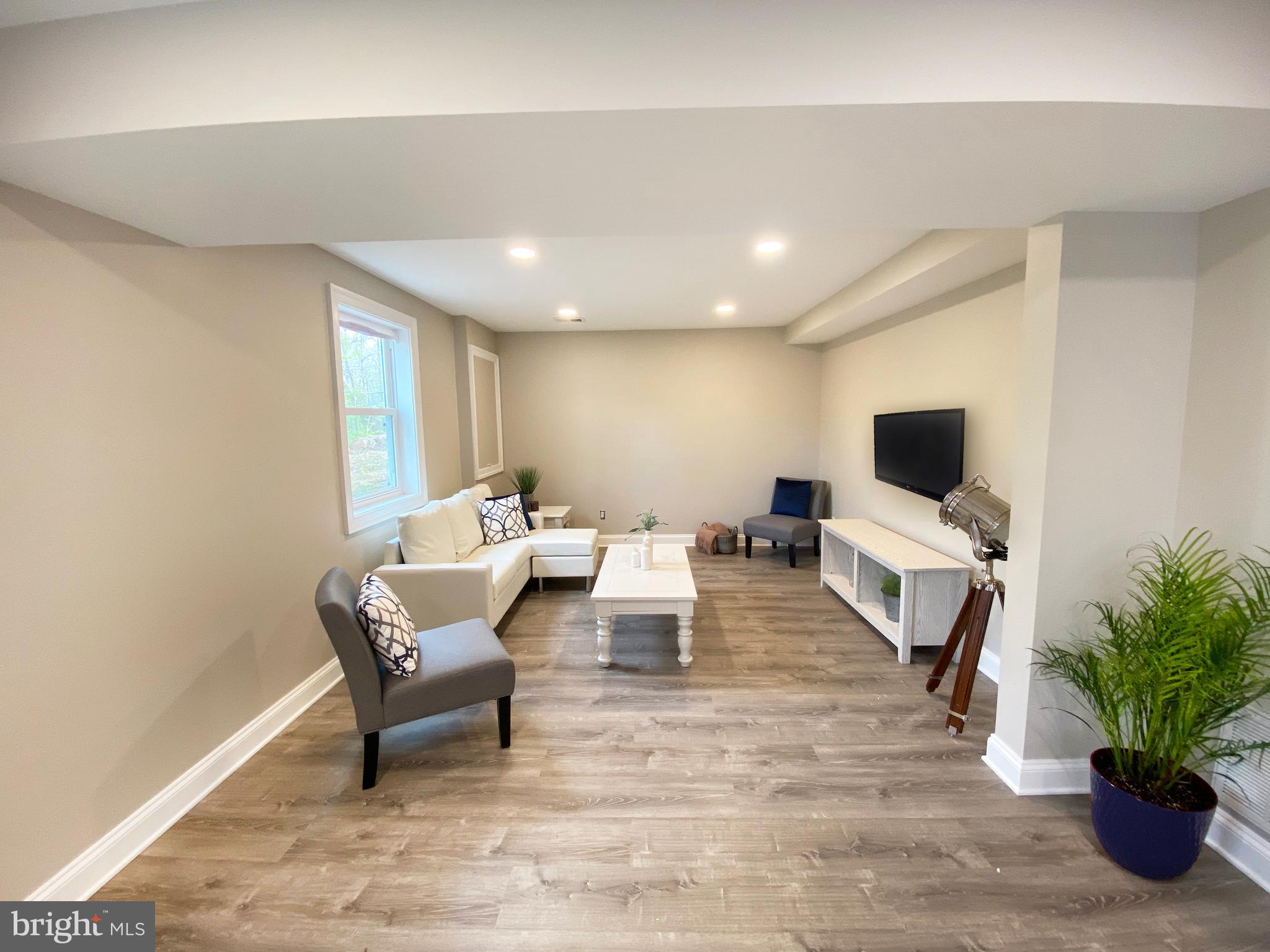3797 Howellsville Road Front Royal, VA 22630 - Photo 15 of 66 a living room with furniture and a flat screen tv