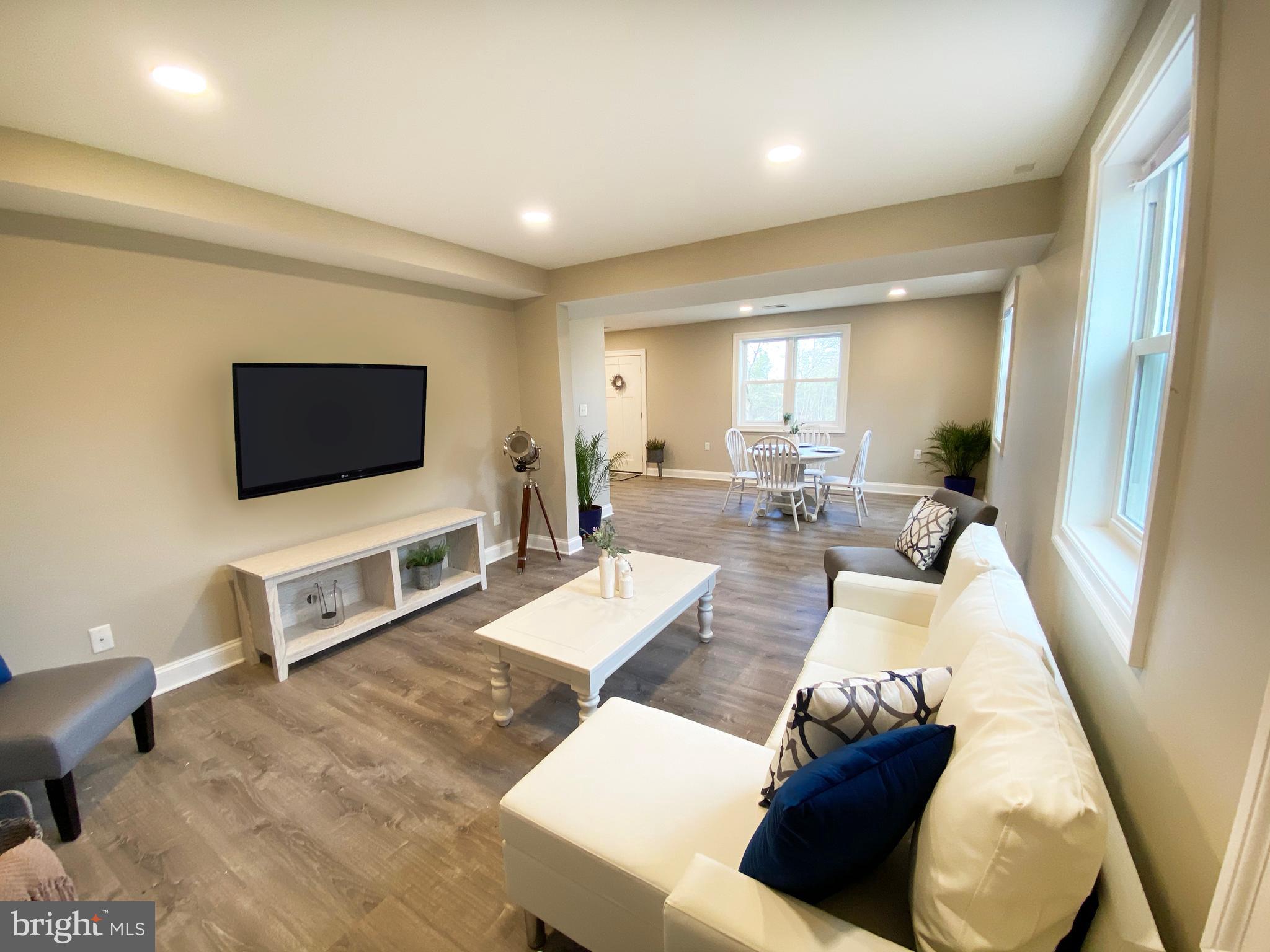 3797 Howellsville Road Front Royal, VA 22630 - Photo 17 of 66 a living room with furniture and a flat screen tv