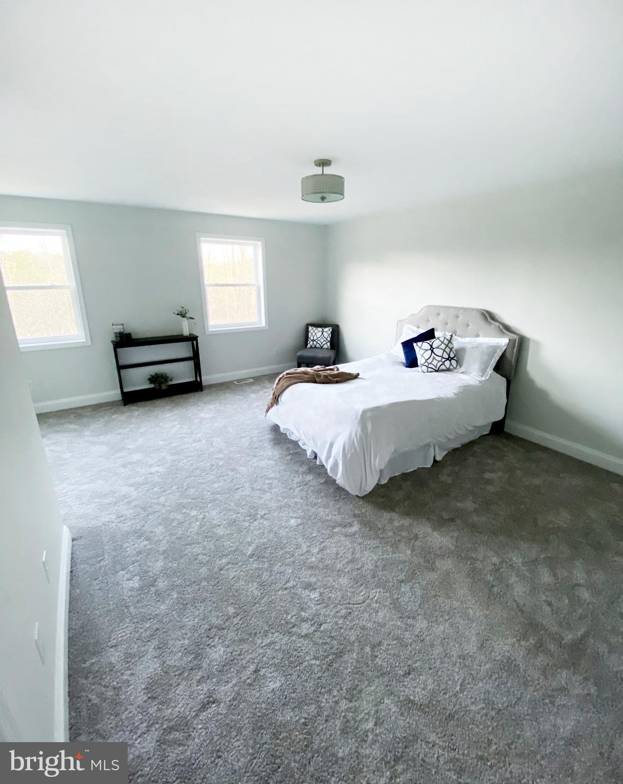 3797 Howellsville Road Front Royal, VA 22630 - Photo 30 of 66 a spacious bedroom with a bed and a window