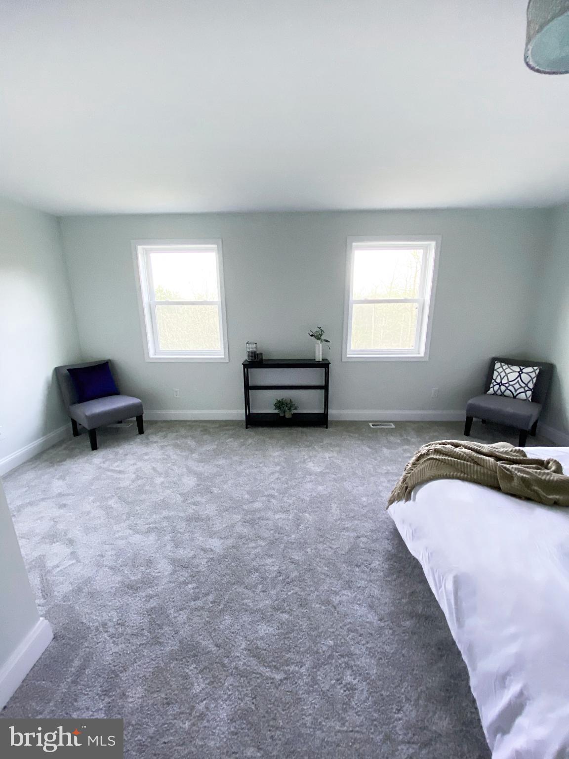 3797 Howellsville Road Front Royal, VA 22630 - Photo 32 of 66 a bedroom with a bed and a window