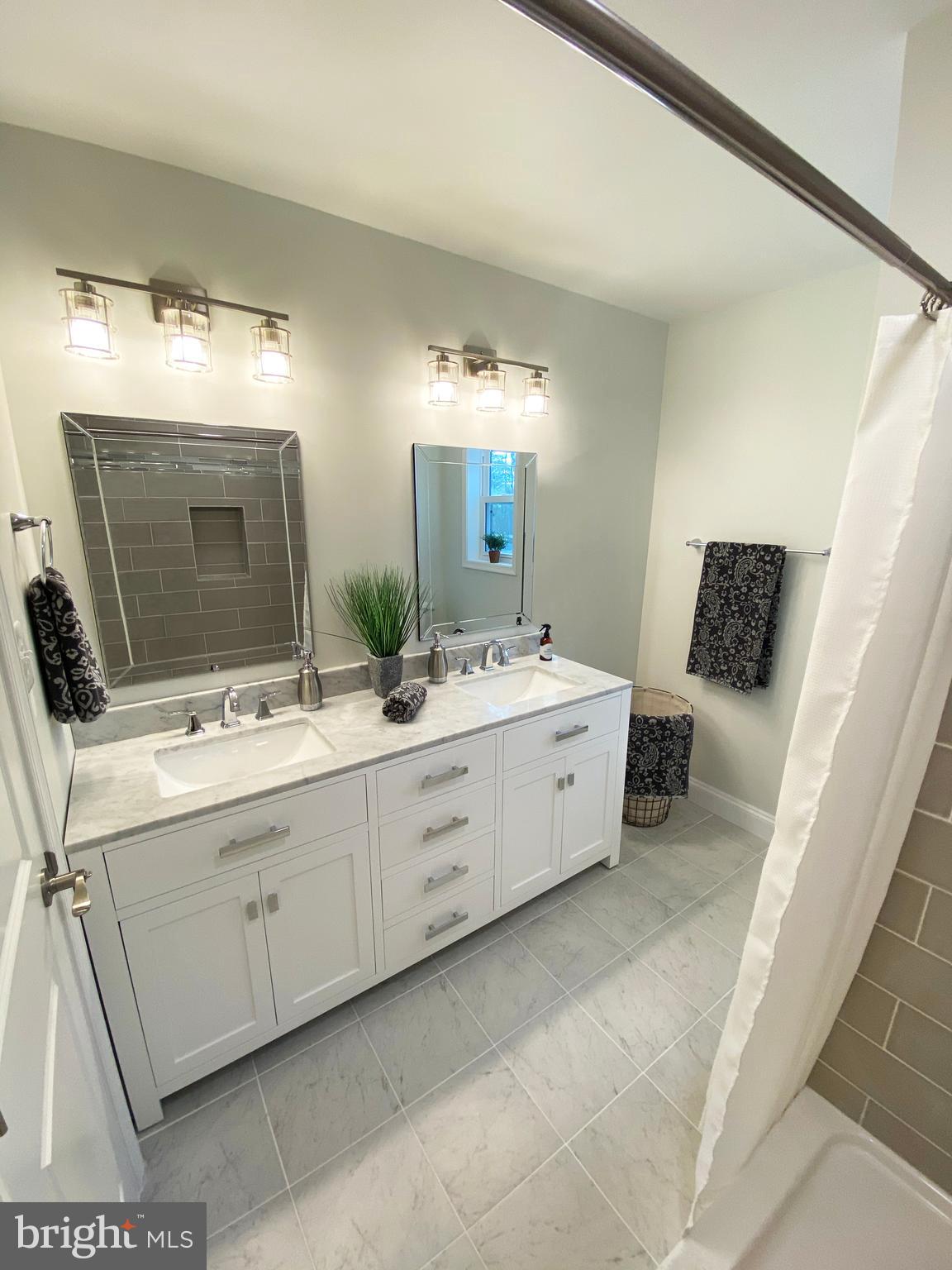 3797 Howellsville Road Front Royal, VA 22630 - Photo 34 of 66 a spacious bathroom with a double vanity sink and mirror