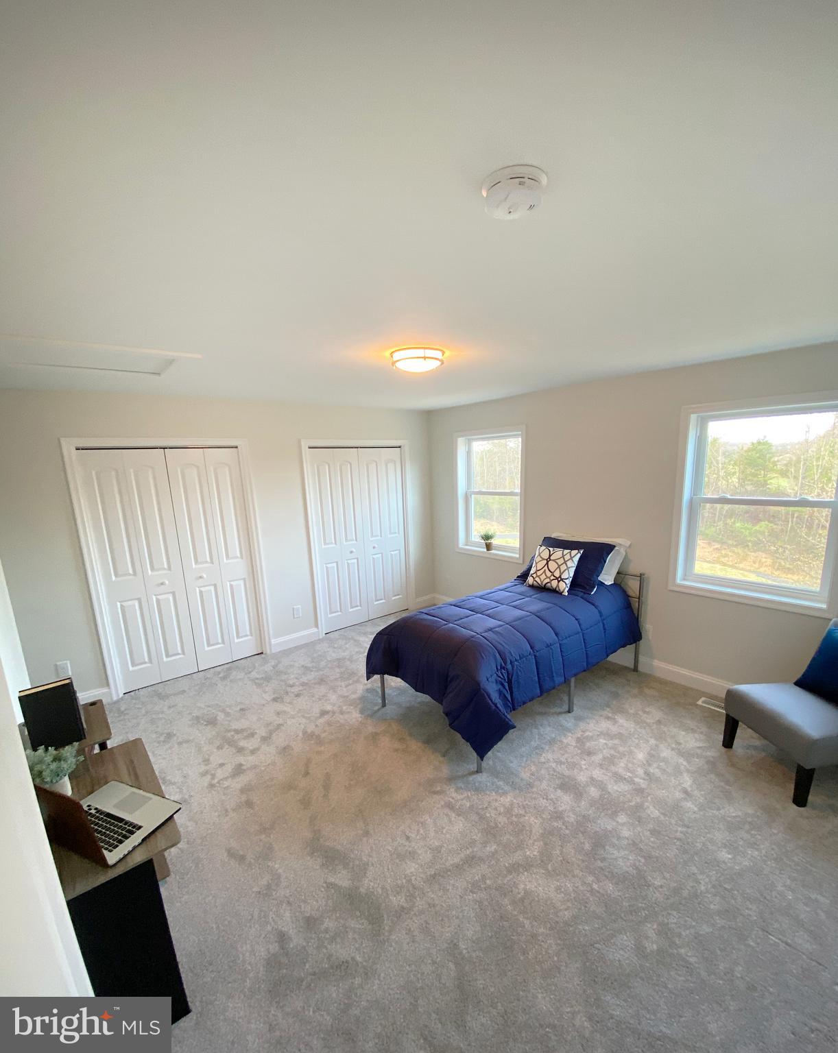3797 Howellsville Road Front Royal, VA 22630 - Photo 41 of 66 a bedroom with a bed and a window