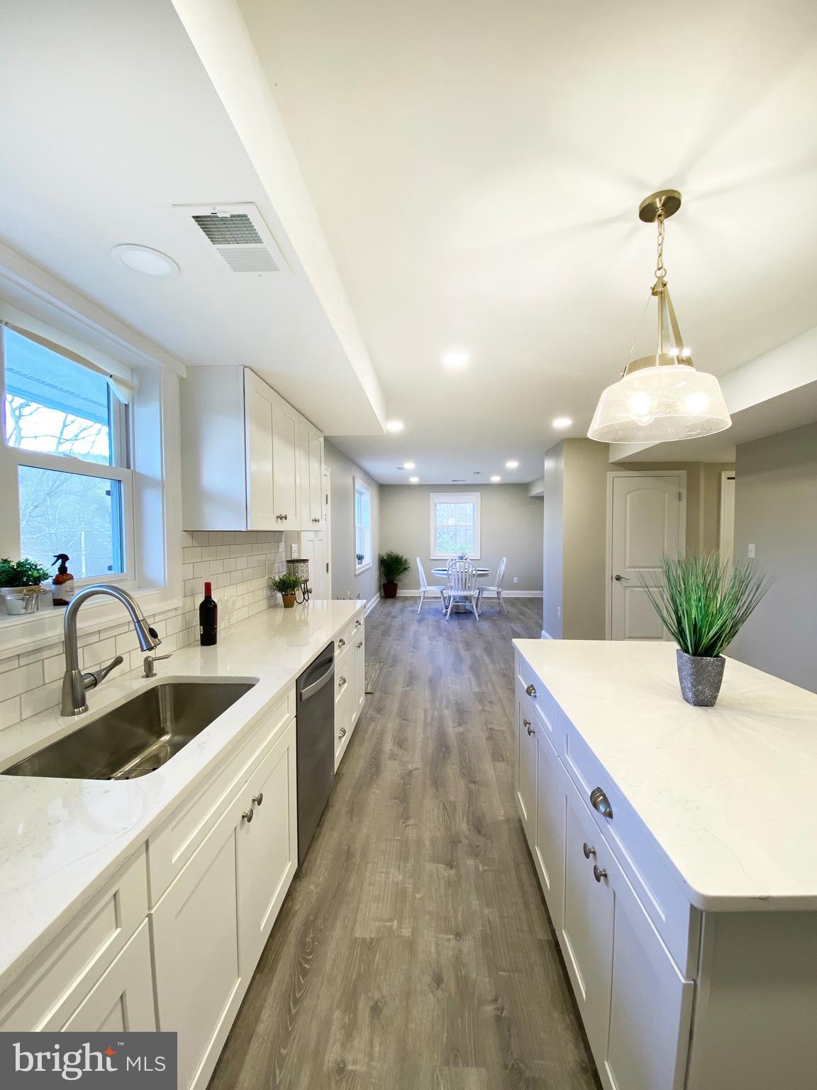 3797 Howellsville Road Front Royal, VA 22630 - Photo 6 of 66 a large kitchen with kitchen island a sink stainless steel appliances and cabinets