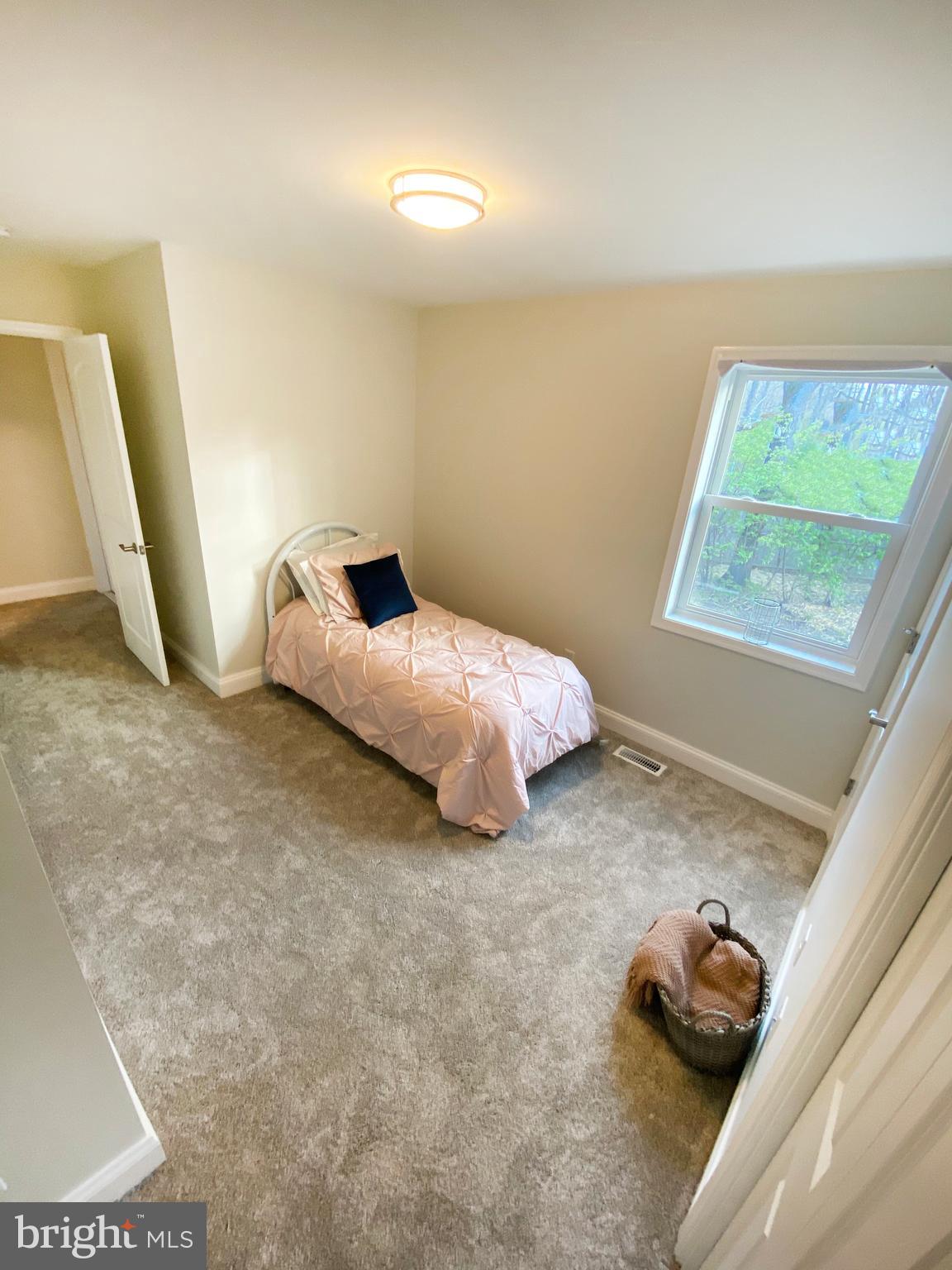 3797 Howellsville Road Front Royal, VA 22630 - Photo 50 of 66 a bedroom with a bed and a window