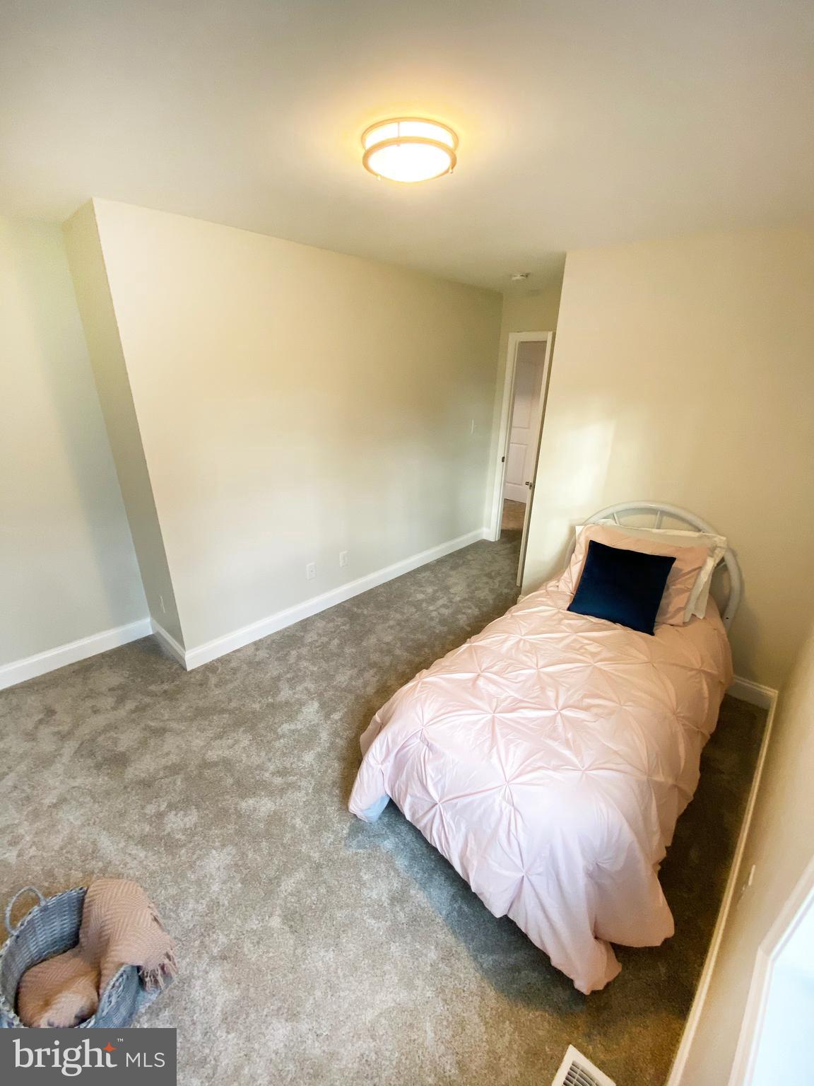 3797 Howellsville Road Front Royal, VA 22630 - Photo 52 of 66 a bedroom with a bed and a window