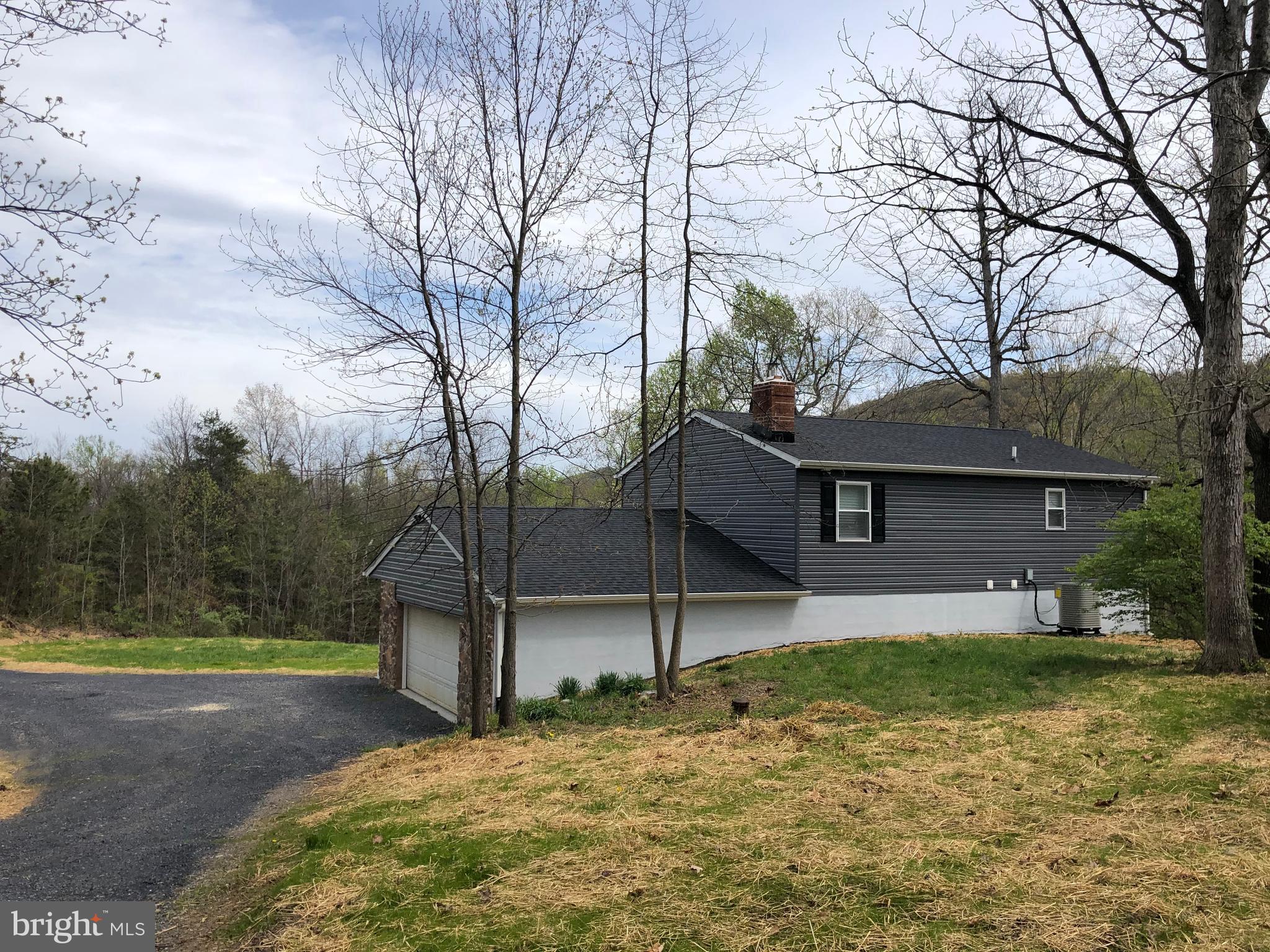 3797 Howellsville Road Front Royal, VA 22630 - Photo 64 of 66 a front view of a house with a yard