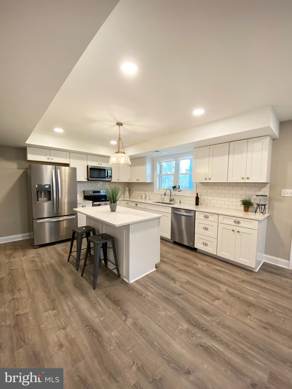3797 Howellsville Road Front Royal, VA 22630 - Photo 10 of 66 a kitchen with a sink a counter top stainless steel appliances and cabinets