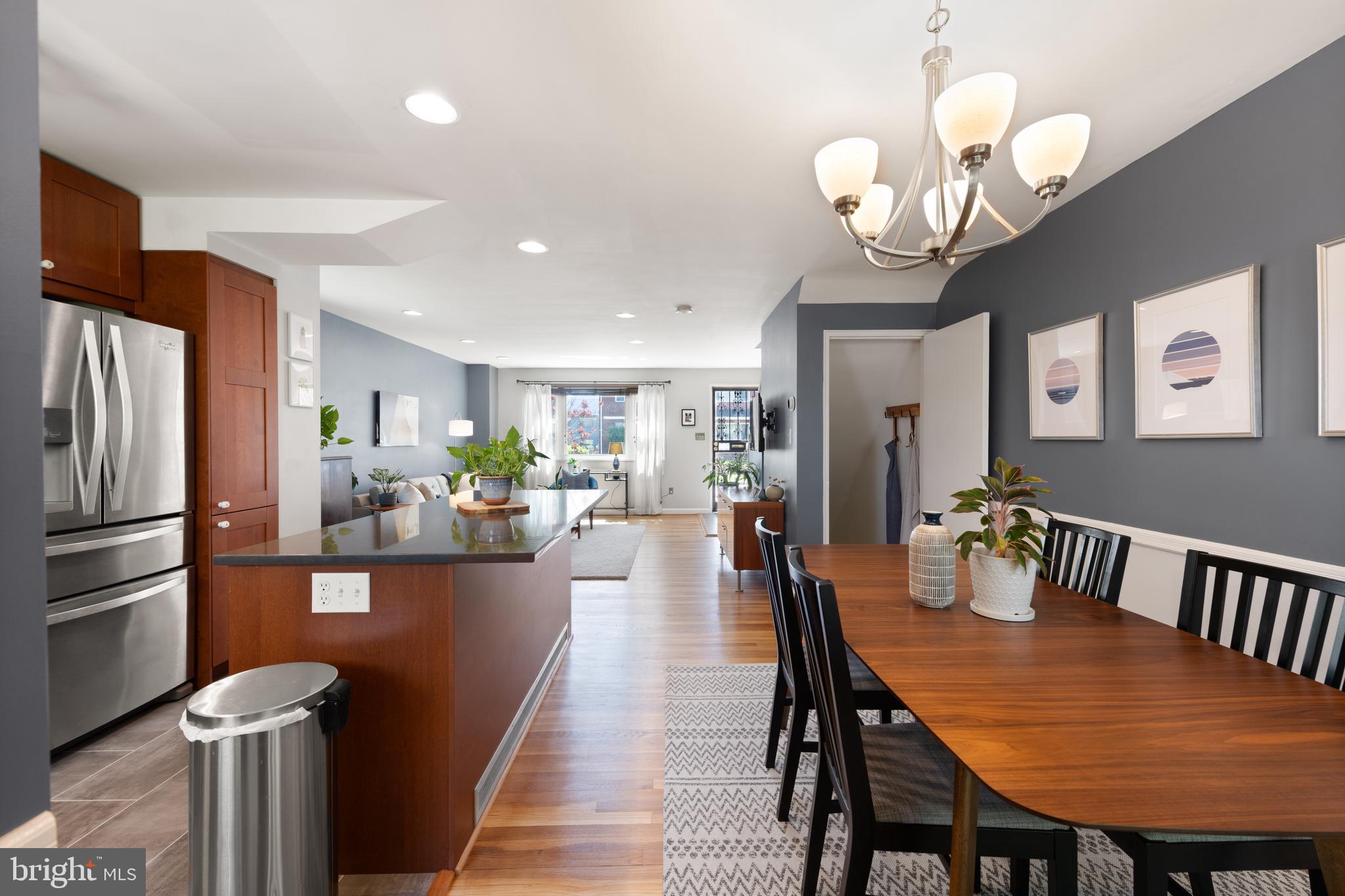 716 Delafield Street Northeast Washington, DC 20017 - Photo 11 of 32 a dining room filled with furniture and a chandelier